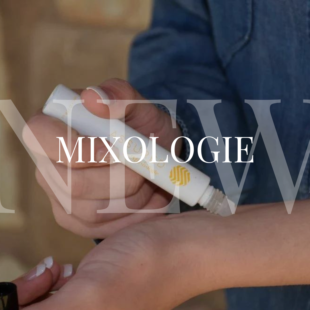 A woman is holding a bottle with the word mixologe on it.