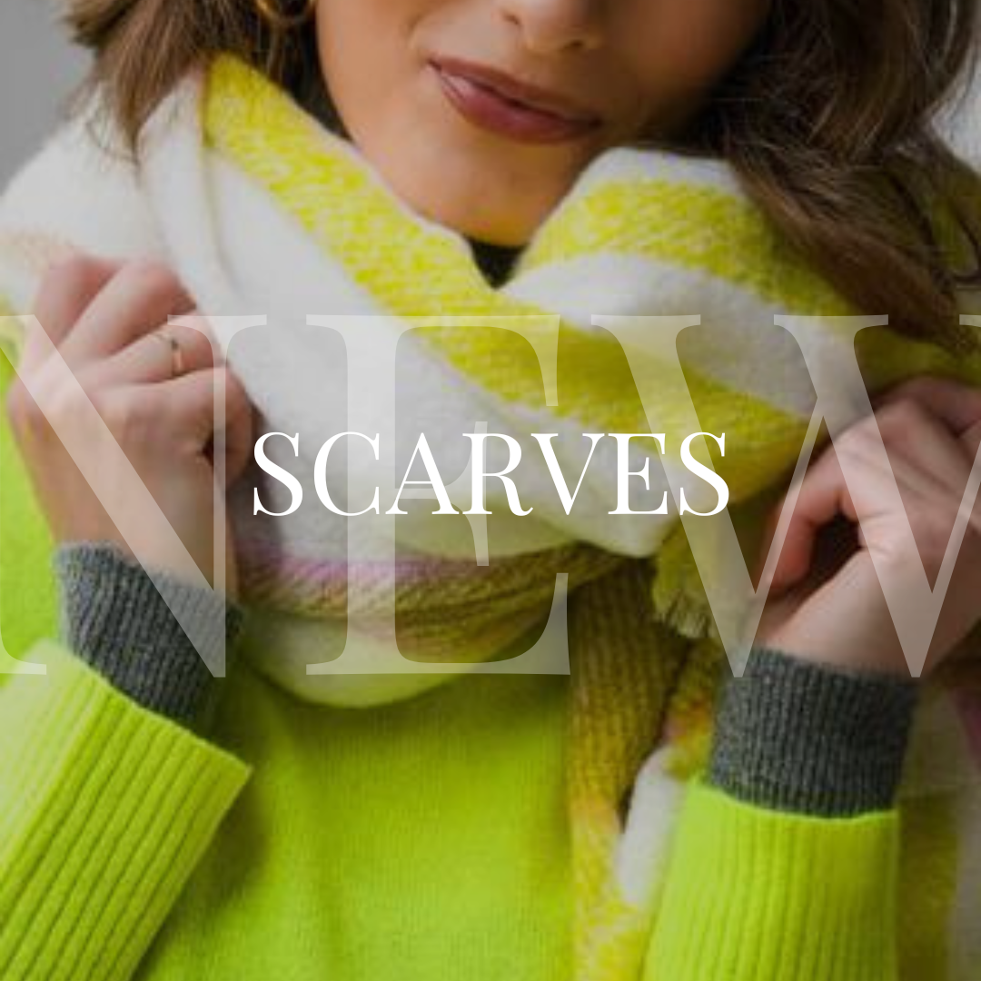 A woman wearing a yellow sweater with the words new scarves.