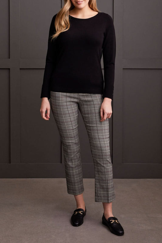 A person wearing a Tribal Boat Neck Sweater with long sleeves and button sleeve details, standing in front of a dark background.