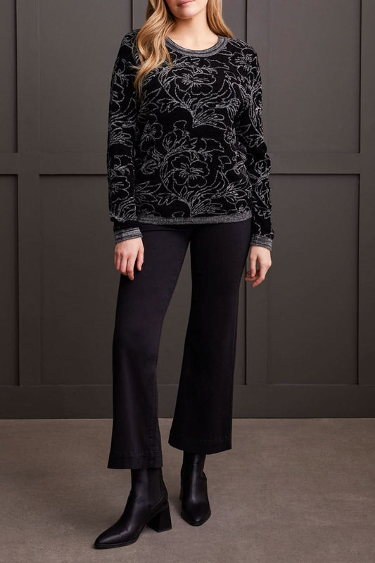 Close-up of a person wearing a cozy, stylish Long Sleeve Scoop Neck Sweater by Tribal, featuring intricate grey floral patterns. The person's head is partially visible, showcasing this perfect piece for fall fashion.