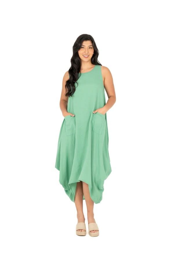 A person exudes effortless chic wearing the M Made In Italy Sleeveless Jade Dress with pockets, set against a plain white backdrop.