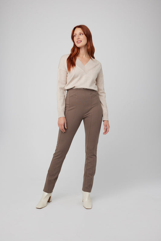 The model is wearing a slimming fit beige sweater and Coco Y Club's Front Seam Slim Pull On Pant in brown, perfect for everyday wear.