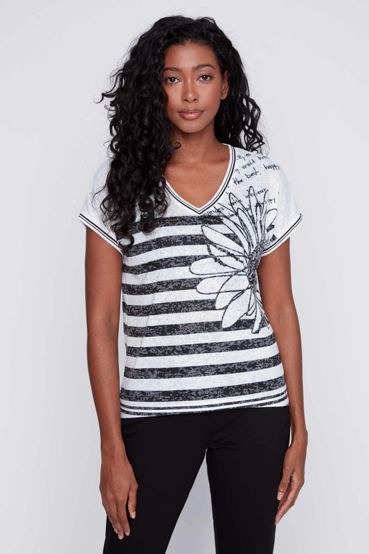 Woman posing in a comfortable CoCo Y Club Striped V-neck tee and black pants for a casual occasion.