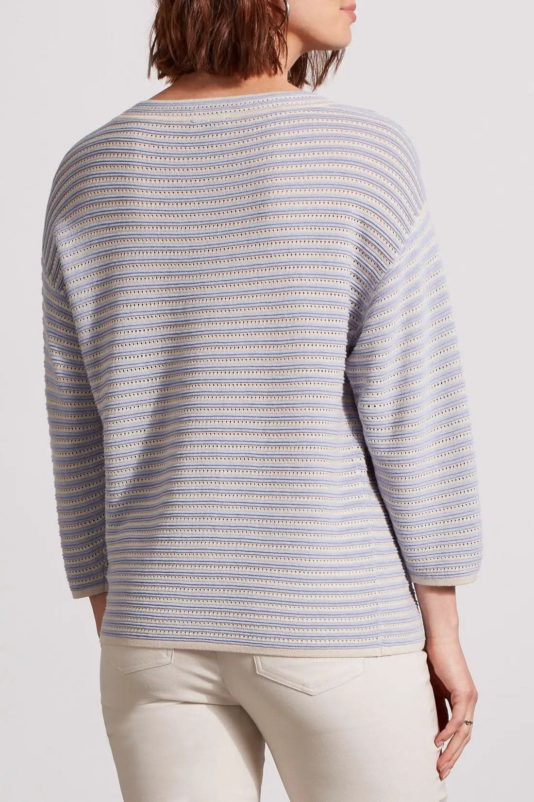 Woman wearing a Tribal 3/4 Sleeve Boat Neck Sweater and white pants.