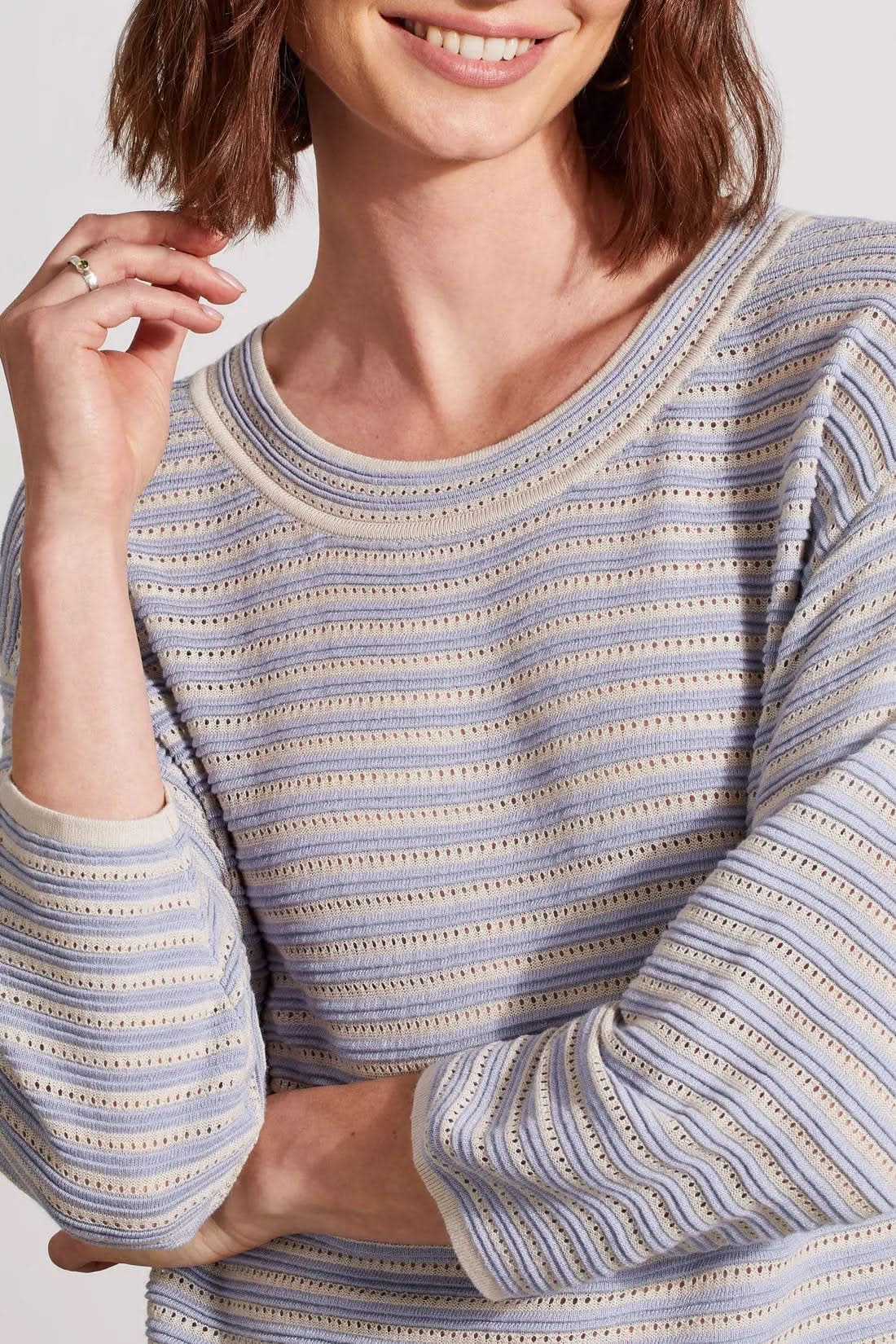 Woman wearing a Tribal 3/4 Sleeve Boat Neck Sweater and white pants.