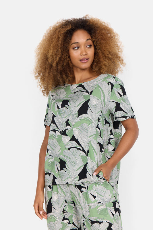The model is wearing a green Soya Concepts Dauphin Leaf short sleeve top.
