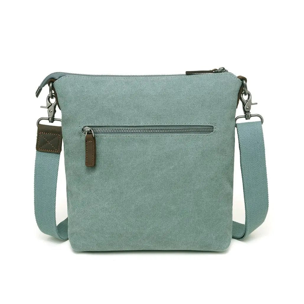 A light blue Davan water repellent crossbody bag with a leather strap and buckle-trim.