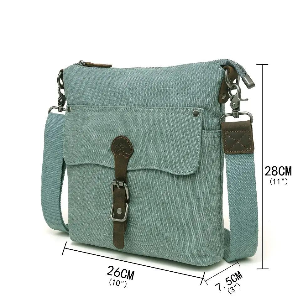 A light blue Davan water repellent crossbody bag with a leather strap and buckle-trim.