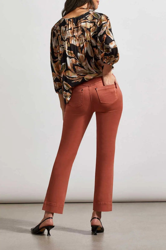 The back view of a woman wearing comfortable Tribal 5 Pocket Pull-on Pants in copper hue.