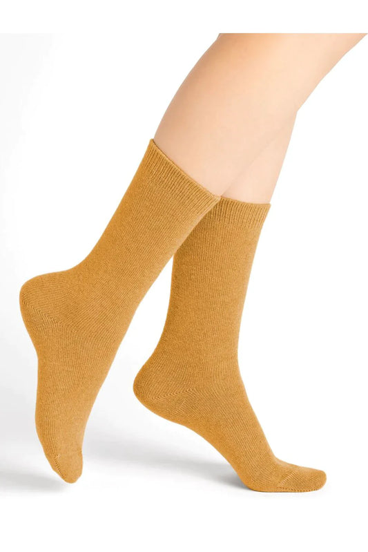 The legs of a woman wearing a pair of Bleuforet 6095 Cashmere Blend Socks.