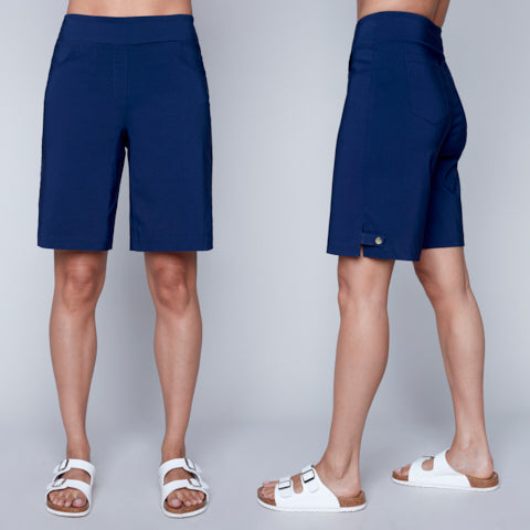 Navy blue Carre Noir woven capri shorts and white sandals showcased from the front and side views.