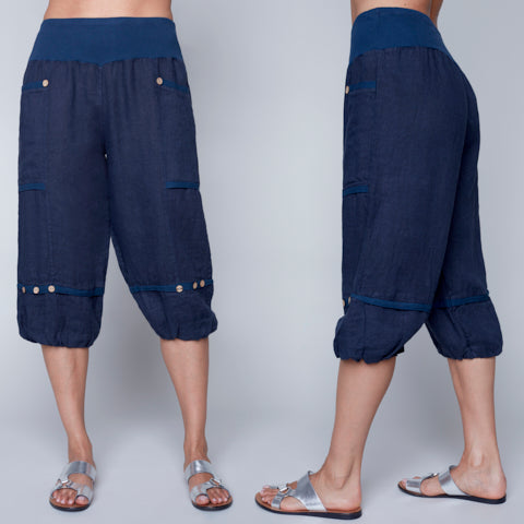 Navy blue Carre Noir Pull On Linen Capri with Button Detail modeled from front and side views for a perfect summer look.