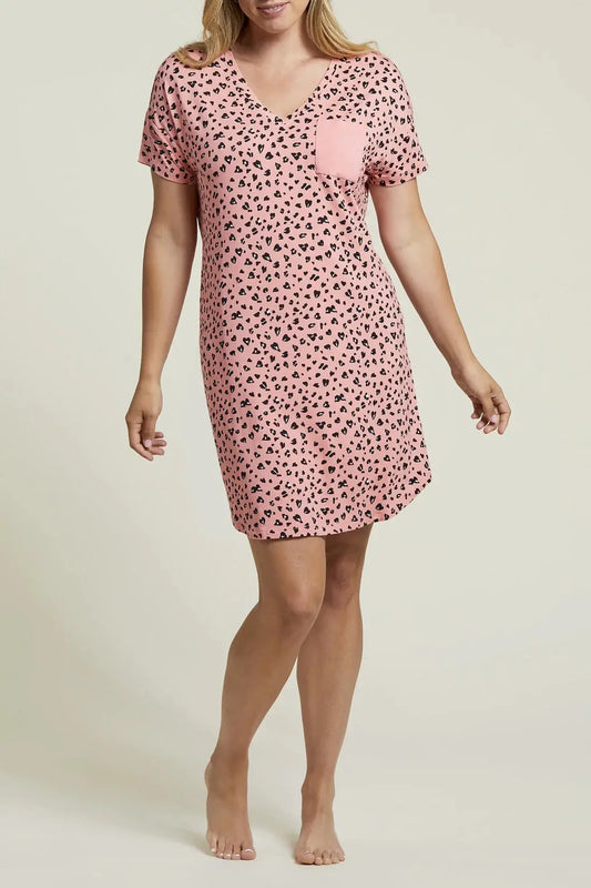 A woman wearing a comfortable Tribal pink polka dot short sleeve night shirt.