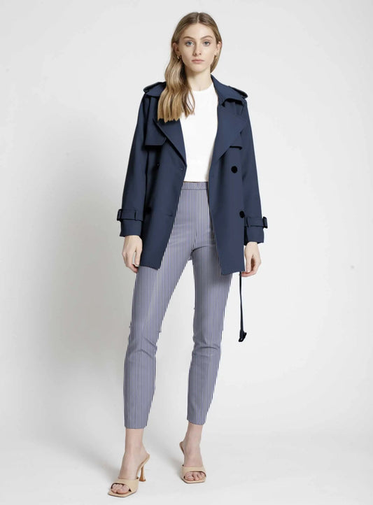 Woman modeling a navy trench coat with comfort-style Point Zero Pull-on Stripe Crop Pants and open-toe heels against a neutral background.