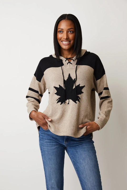 A woman wearing a high quality Cotton Country Hockey Hoodie with a Team Canada logo.