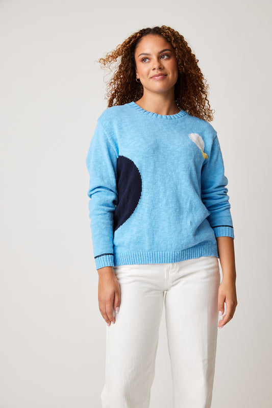 A woman with impeccable style wearing a Cotton Country Denny Dot Dot blue sweater.