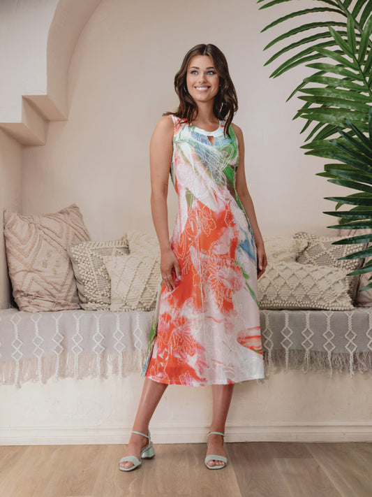 A woman is posing for a photo in an Alison Sheri Floral Print Sleeveless with Key Hole Neckline dress.