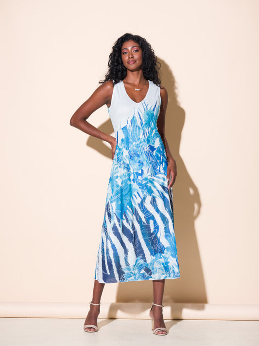 A woman exudes elegance and comfort in an Alison Sheri Zebra Floral Print Dress.