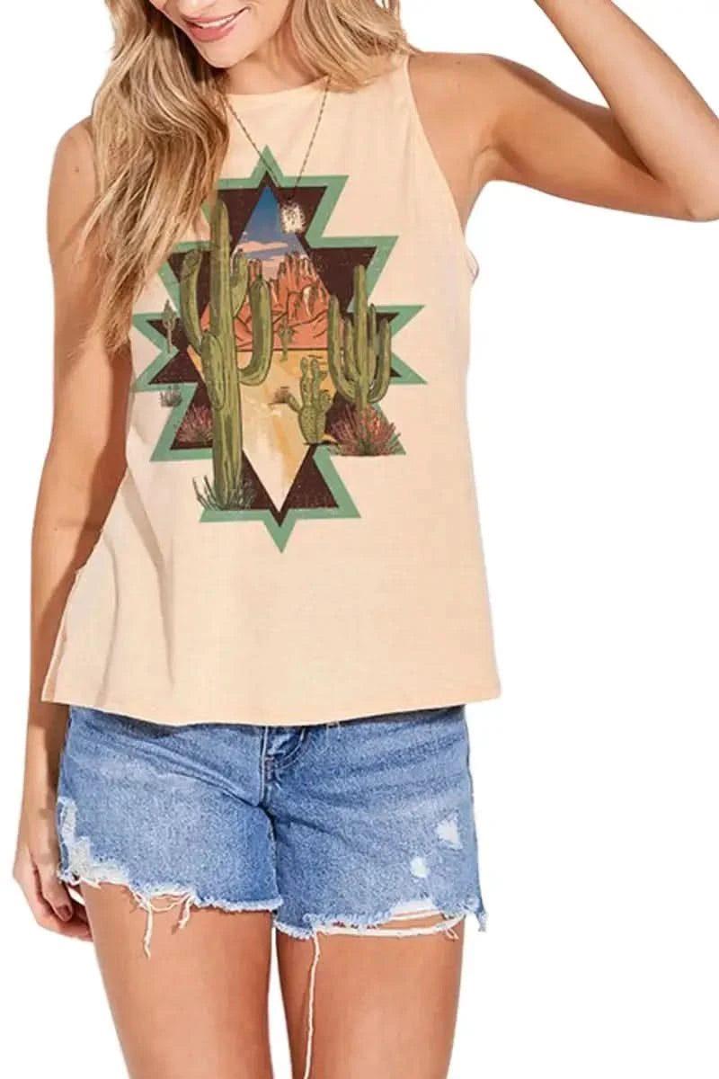 A woman in a "Aztec Print Country Trendy" tank top from Don't Be Chy Boutique, blue jeans, and a brown hat poses with her arms raised, touching the brim of the hat.