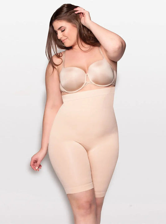 A woman posing in a beige bodysuit and bra with anti-slipping control levels against a white background by Body Hush's The Sculptor All In One.