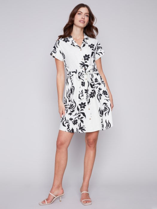 A modern white and black floral print Charlie B shirt dress, featuring unique design with short sleeves.