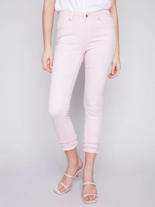 Woman wearing Charlie B's Denim Fringe Crop Pant and clear heeled sandals, a trendy addition to her summer wardrobe.