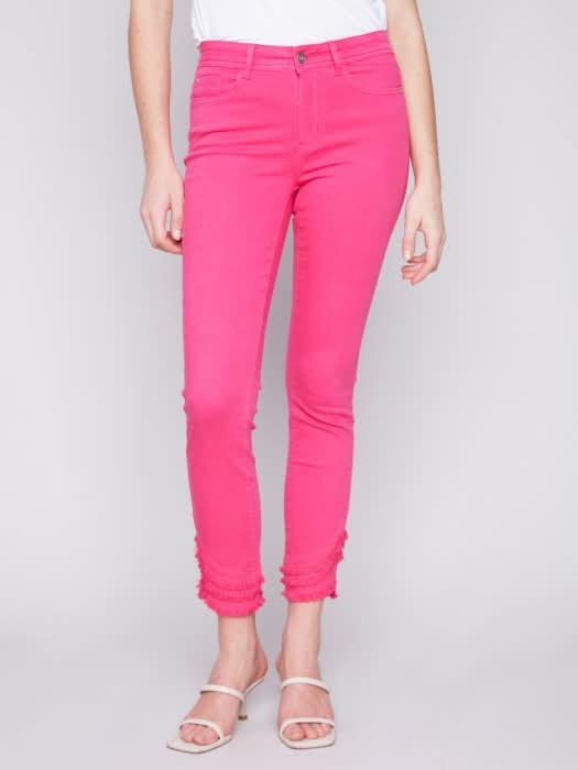 The model is wearing a cute and stylish design, combining a white t-shirt with Charlie B's Slant Fringe Ankle Pant.