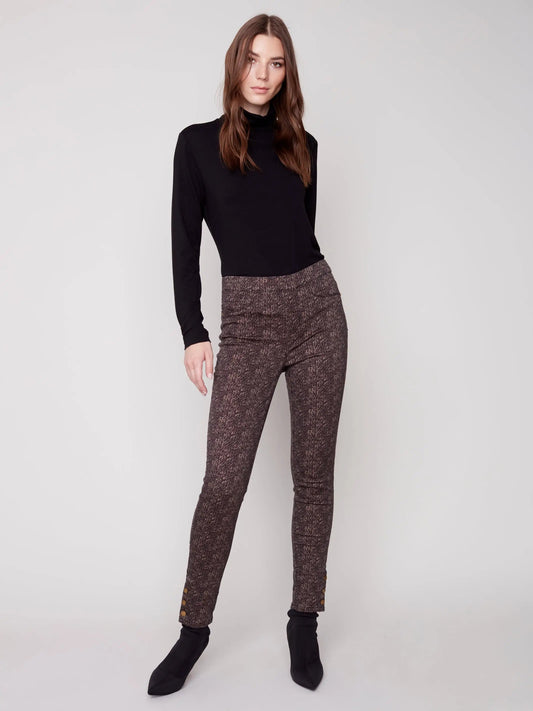 The model is wearing a black turtleneck and brown Charlie B Printed Twill Pull On Pant.