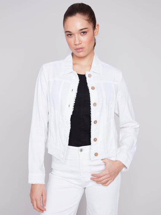 The model is wearing a Charlie B Solid White Button Up Linen Jacket.