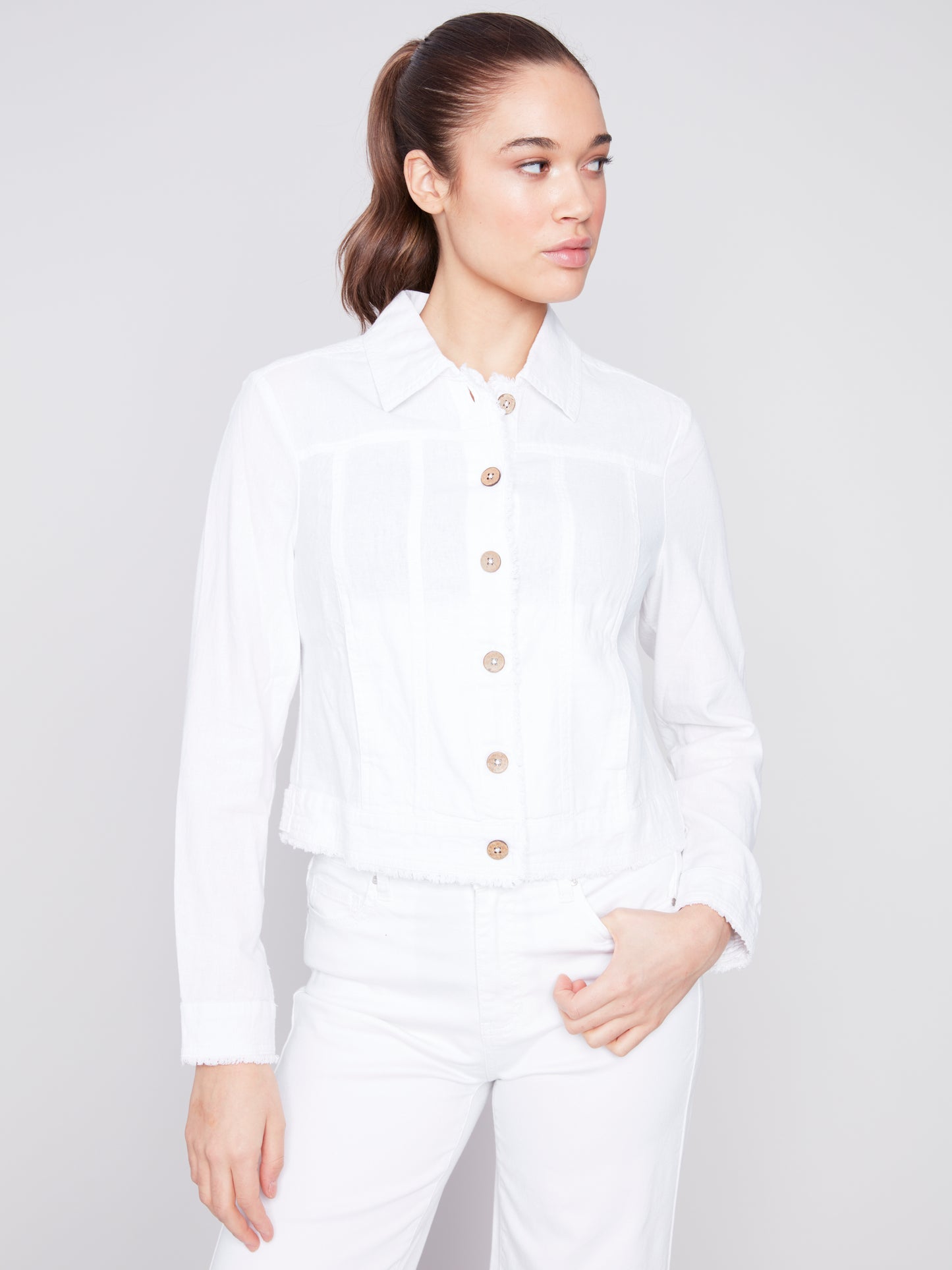 The model is wearing a Charlie B Solid White Button Up Linen Jacket.