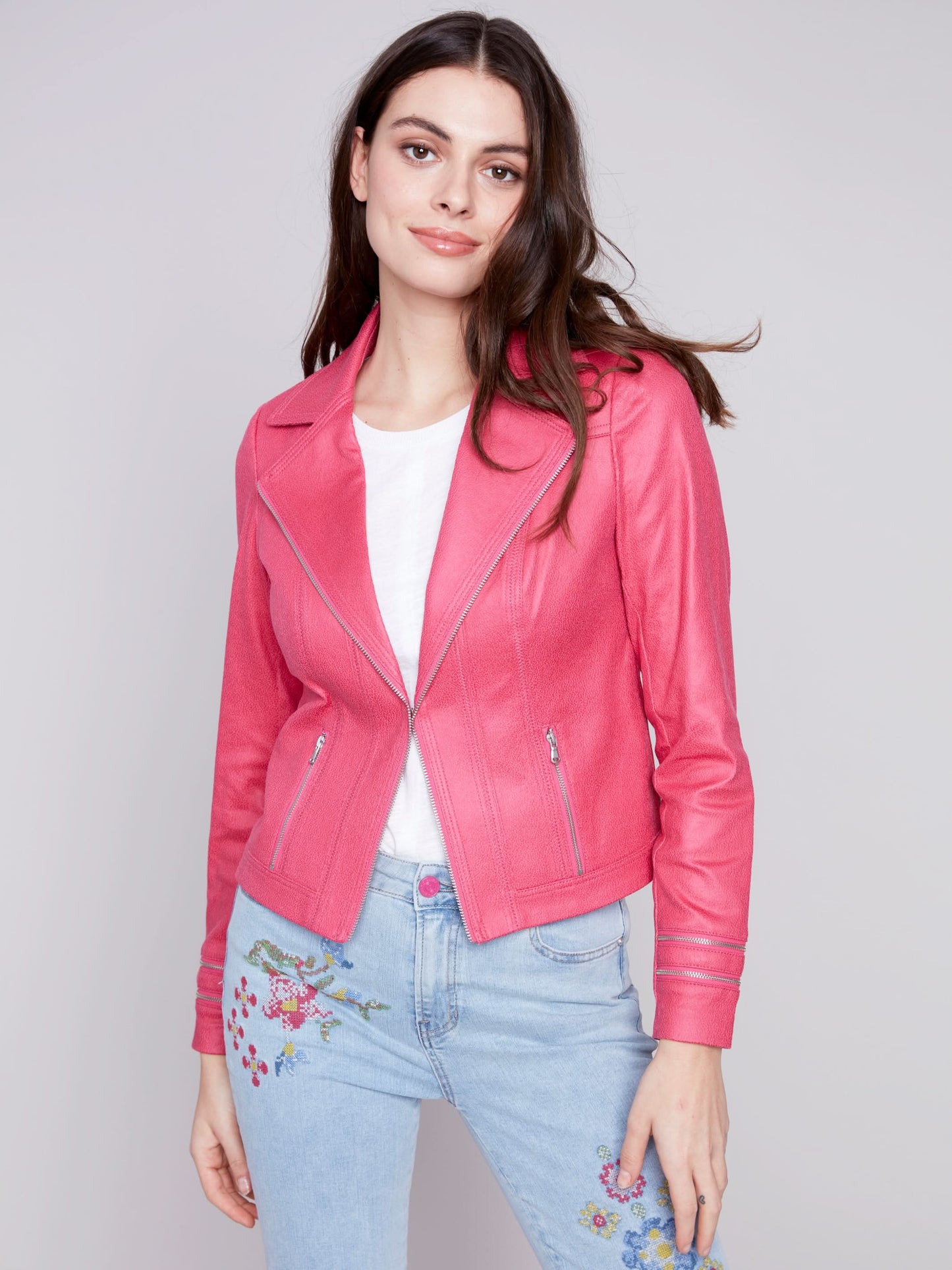 A woman wearing a yellow Charlie B Vintage Moto Faux Leather Jacket.