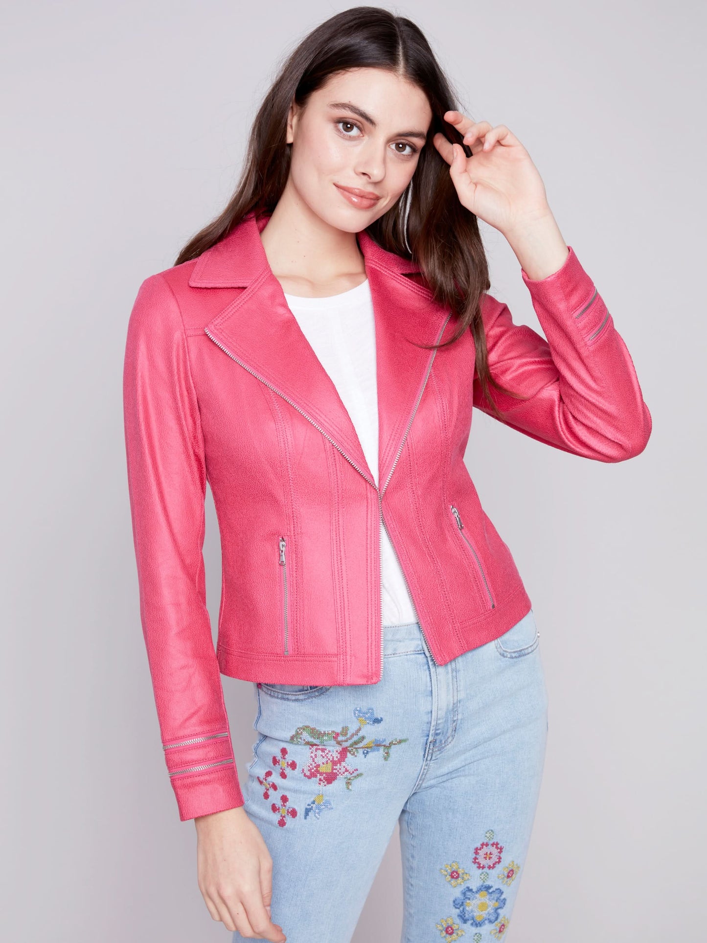 A woman wearing a yellow Charlie B Vintage Moto Faux Leather Jacket.