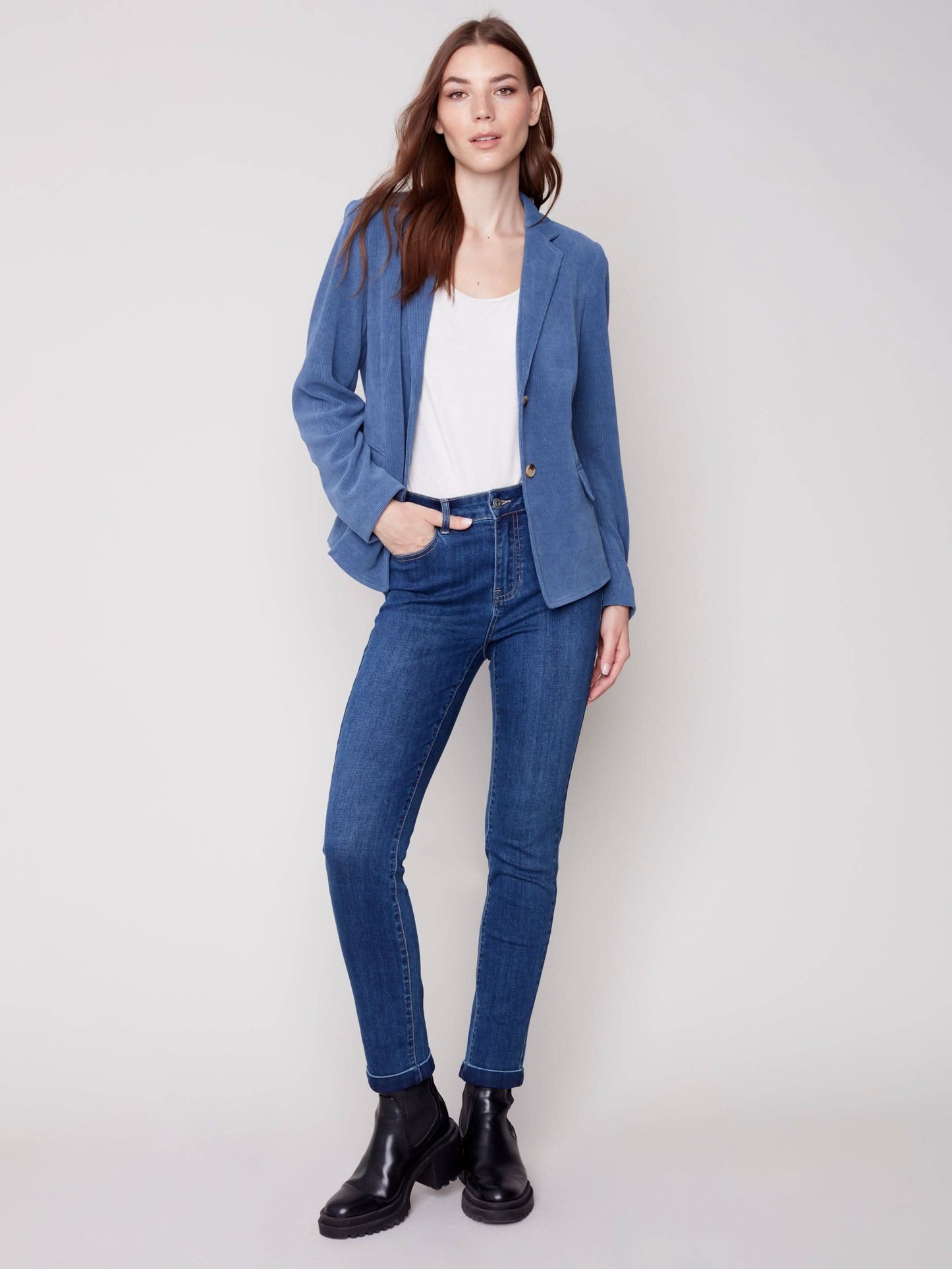 The model is wearing jeans and a Charlie B Buttoned-front Corduroy Blazer.
