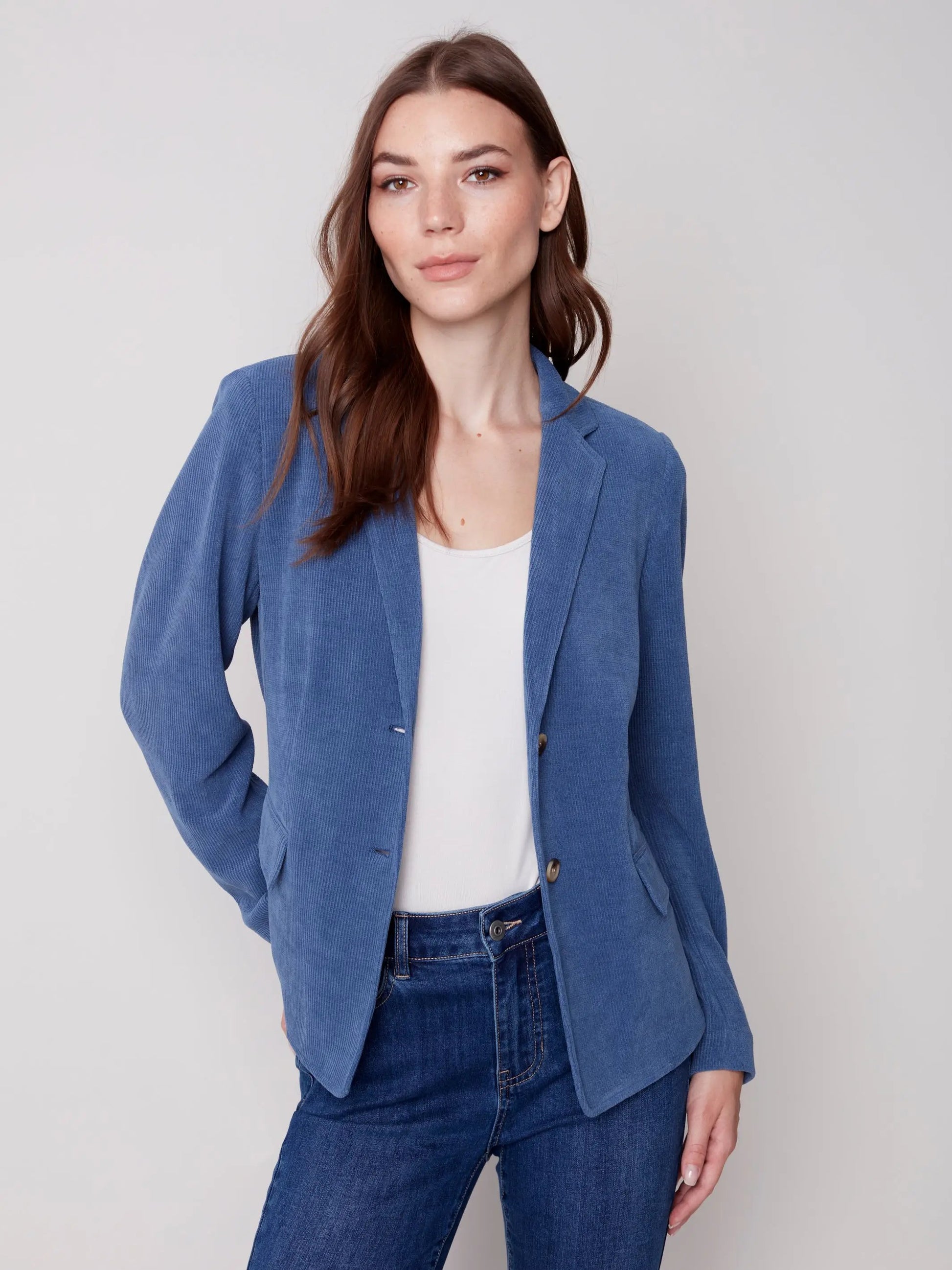 The model is wearing jeans and a Charlie B Buttoned-front Corduroy Blazer.