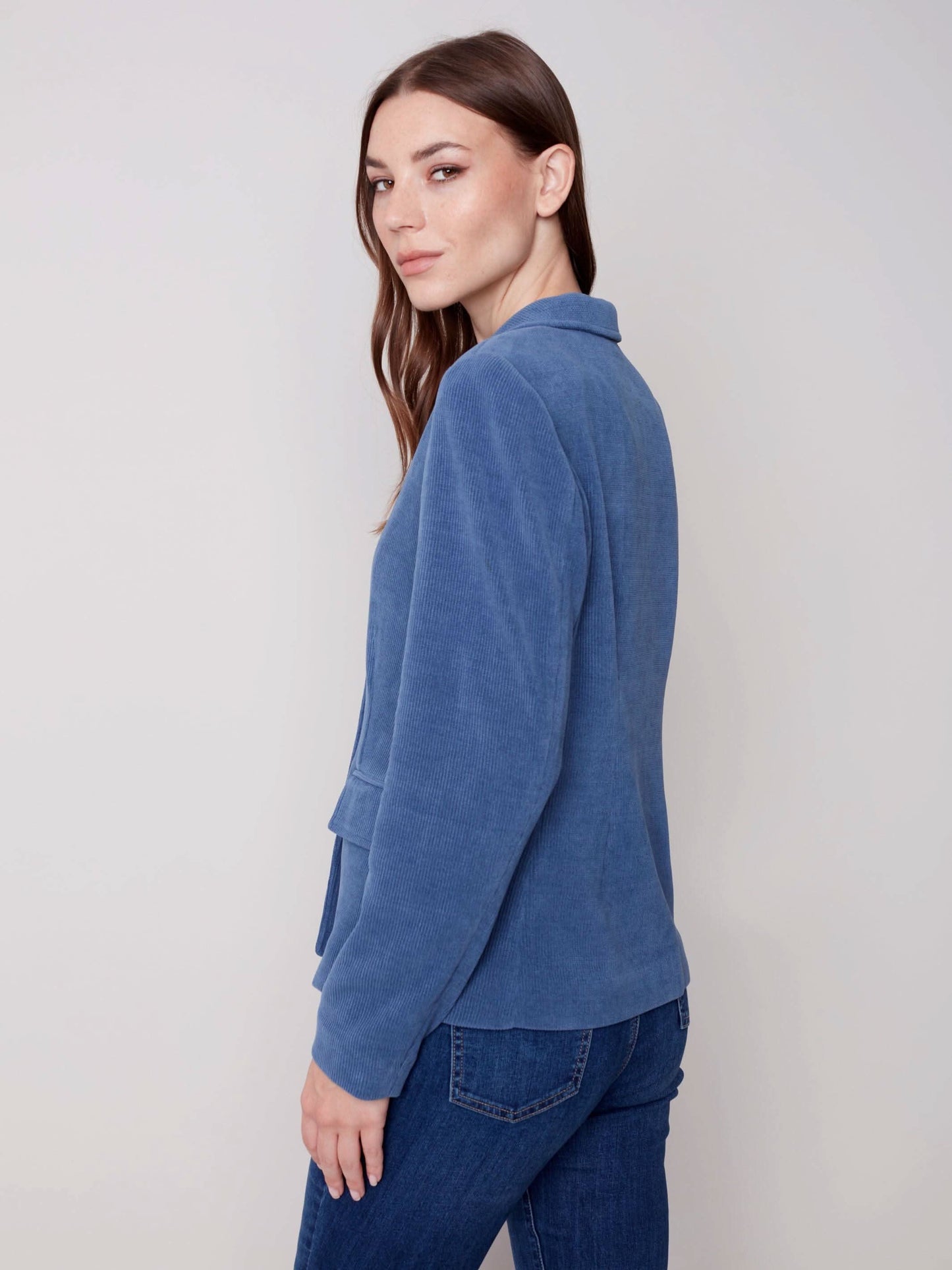 The model is wearing jeans and a Charlie B Buttoned-front Corduroy Blazer.
