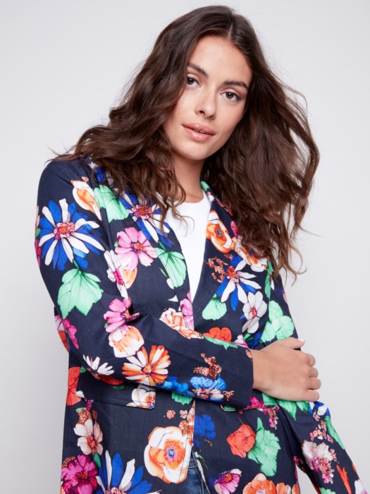 Woman wearing a Charlie B Floral Printed Linen Blazer and jeans, perfect for her summer wardrobe.