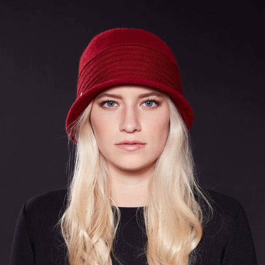 A young woman wearing a Canadian Hat's Packable Cloche Hat.