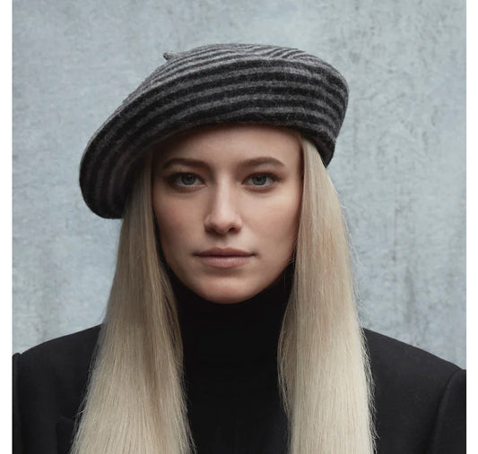 A woman with long blonde hair wearing a Canadian Hat Blaire Striped Beret Hat.