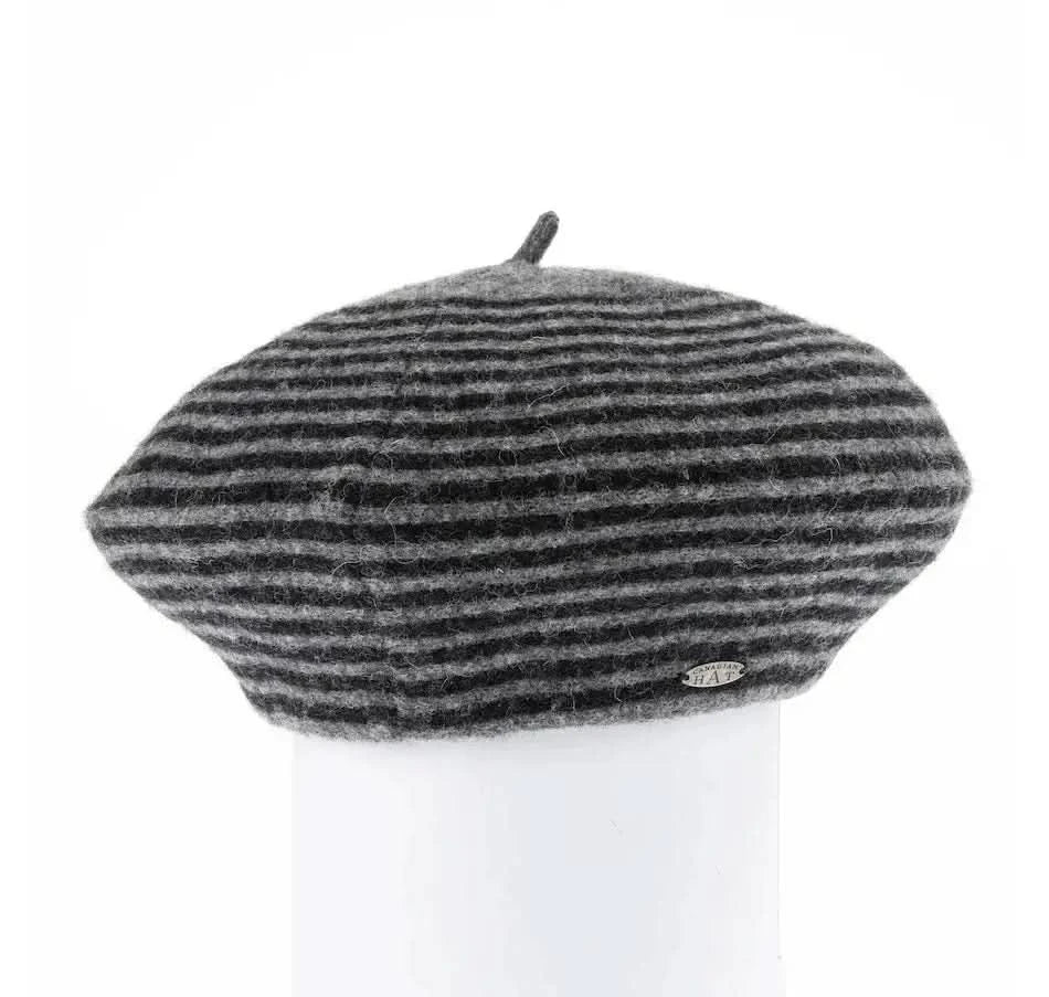 A woman with long blonde hair wearing a Canadian Hat Blaire Striped Beret Hat.