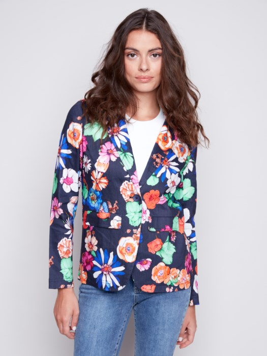 Woman wearing a Charlie B Floral Printed Linen Blazer and jeans, perfect for her summer wardrobe.