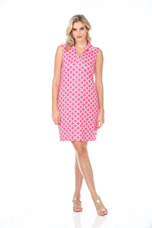 A woman in a Tango Mango 1/4 Zip Sleeveless Dress with a pink and white pattern stands against a pristine white background.