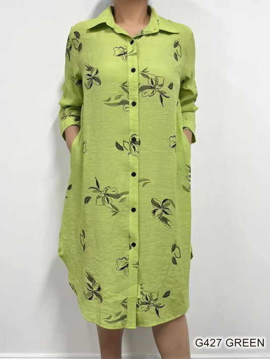 A green flower print linen dress by Fashion Cage displayed on a mannequin against a white background.
