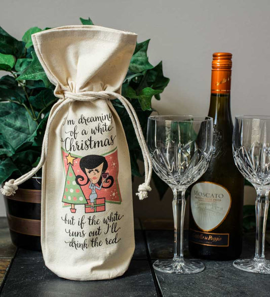 A bottle sleeve perfect for gifting an I'm Dreaming of a Wine bottle by Pinetree Innovations.