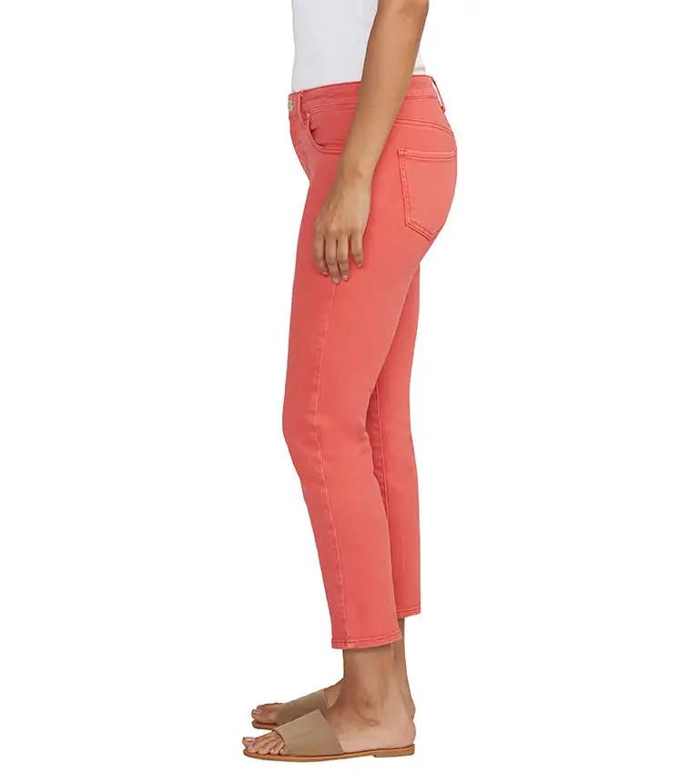 A person standing in Cassie Crop Jeans from Jag with a slim fit and tan shoes against a white background.