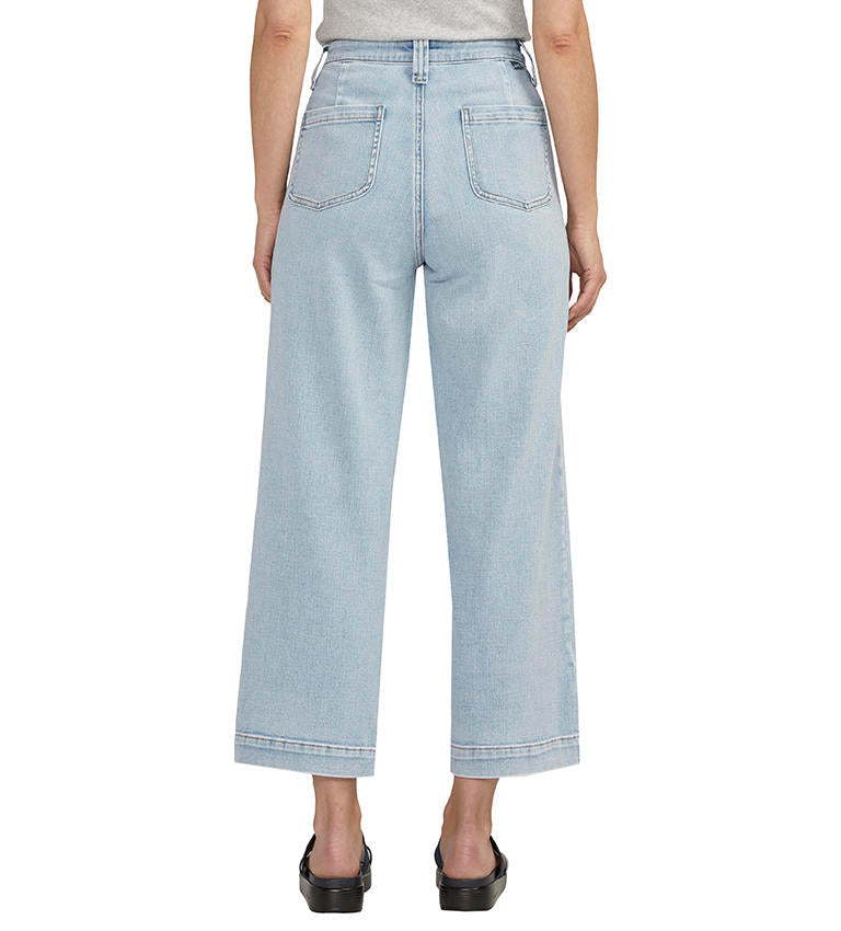 Light-wash Sophia Wide Leg Crop Jeans paired with black sandals by Jag.