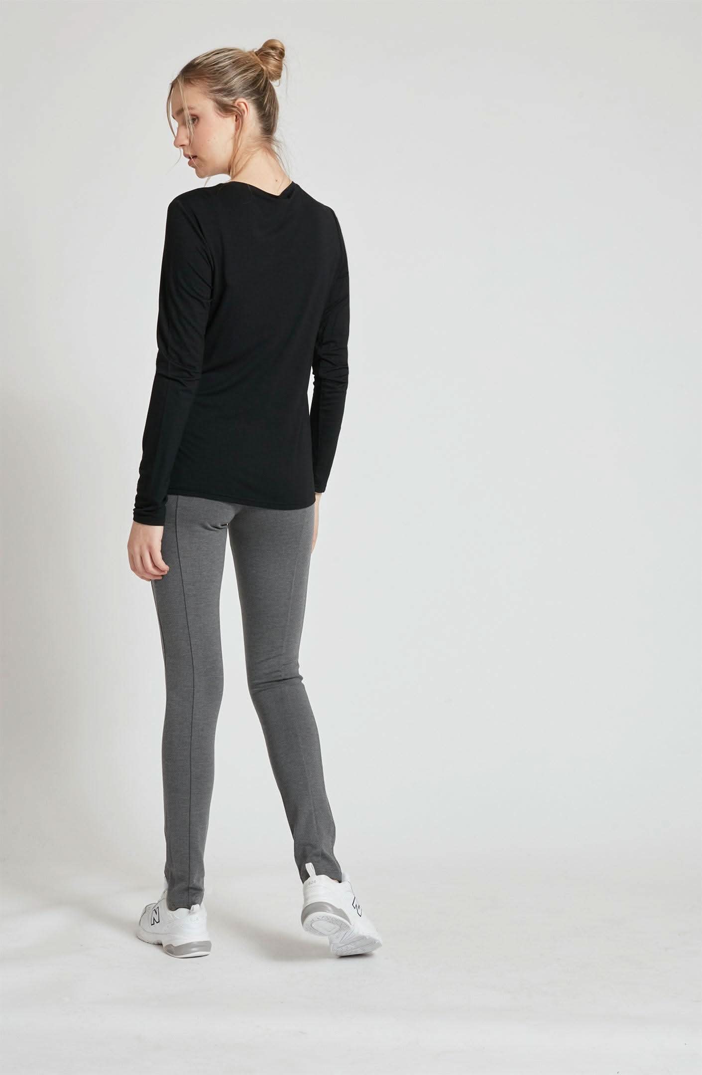 A woman wearing a Point Zero MOL4108 - Basic Top.