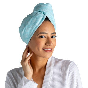 A package of Lemon Lavender Microfiber Turbo Towels with Button Closure | Plot Twist, featuring an image of a woman's face.