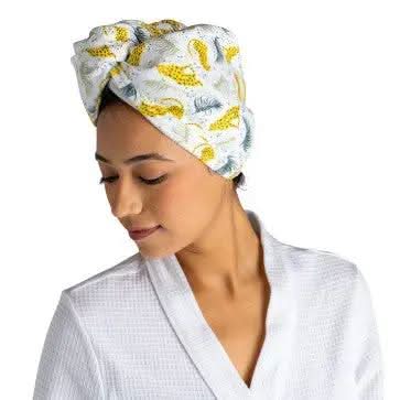 A package of Lemon Lavender Microfiber Turbo Towels with Button Closure | Plot Twist, featuring an image of a woman's face.