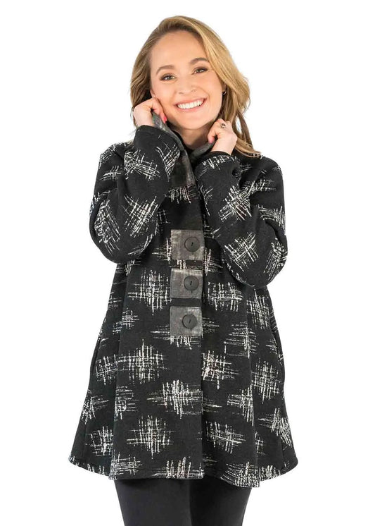 A woman wearing a Trisha Tyler Button Up Collared Coat for an occasion.