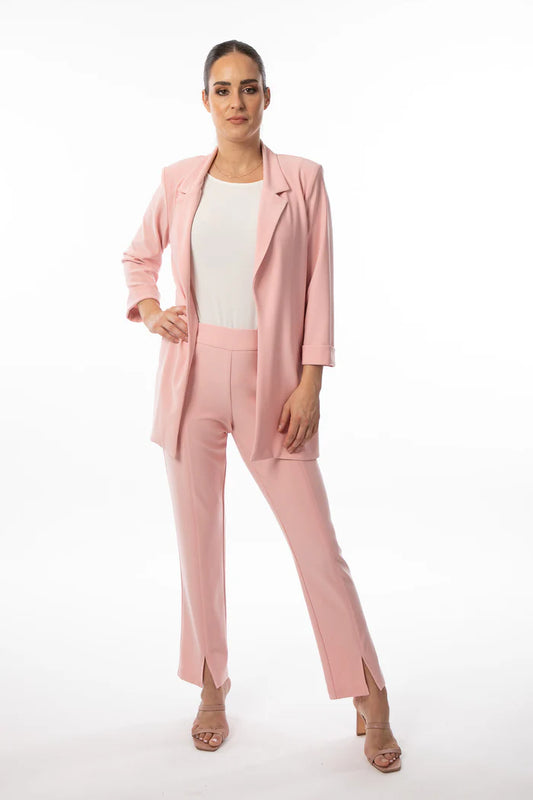 Woman standing confidently in a Bali 8335 Rose Blazer with a white top and heeled sandals against a white background.